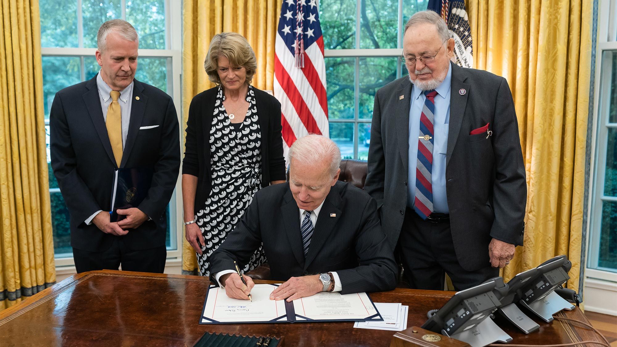 Alaska’s Congressional Delegation from left, senators Dan Sullivan and Lisa Murkowski and Congressman Don Young, at a White House ceremony as President Biden signed into law H.R. 1318, the Alaska Tourism Restoration Act.