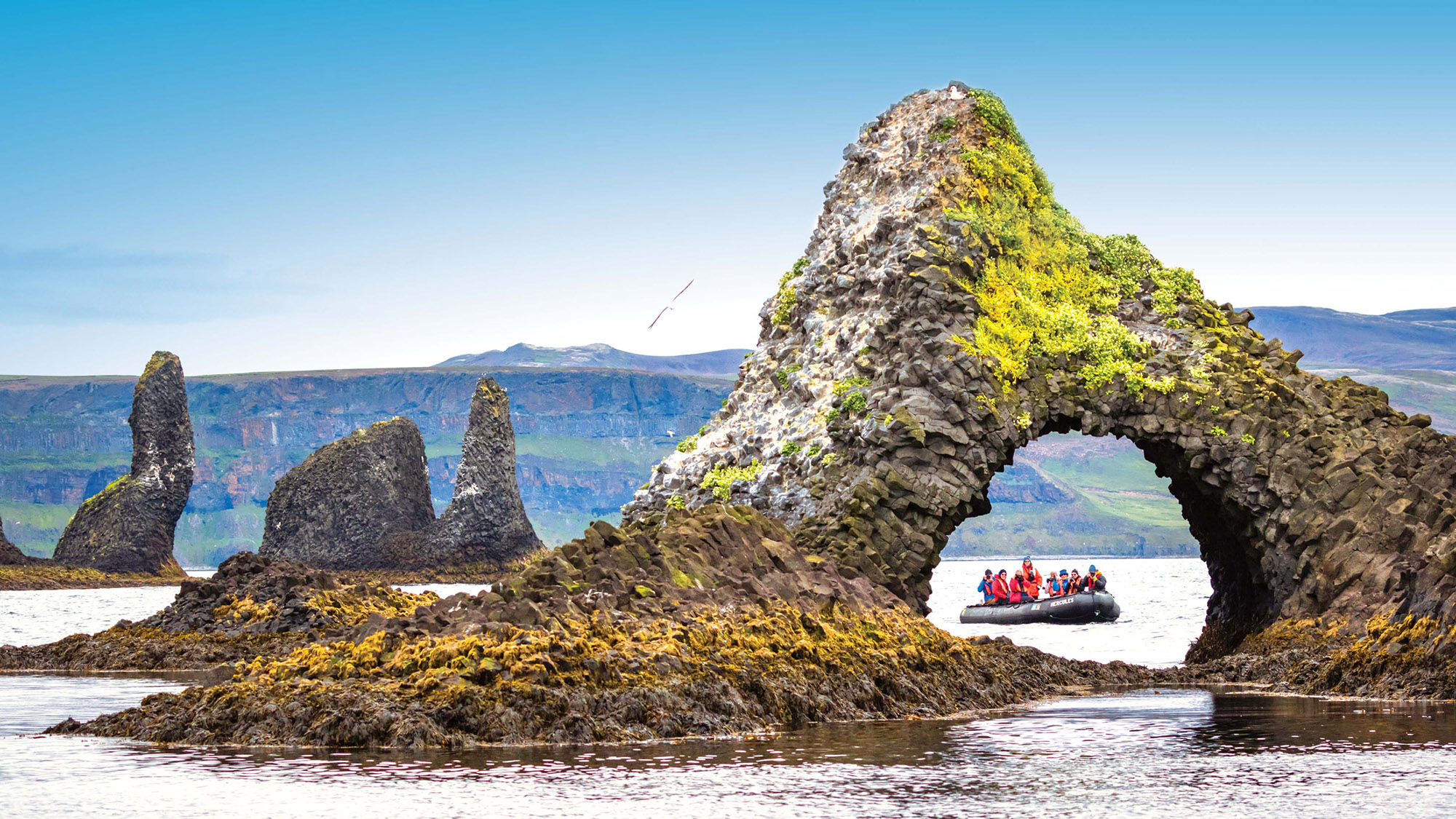 Lindblad Expeditions passengers on a Zodiac excursion in Iceland.