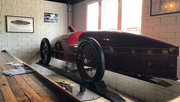 A replica of the steam-powered Stanley Rocket, an early race car, sits in the window at the Ormond Garage restaurant in Ormond Beach