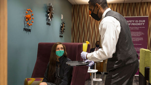 Escape Lounges is gradually opening its network of lounges in the U.S. Customers must remained masked, per federal mandate, when not eating or drinking.