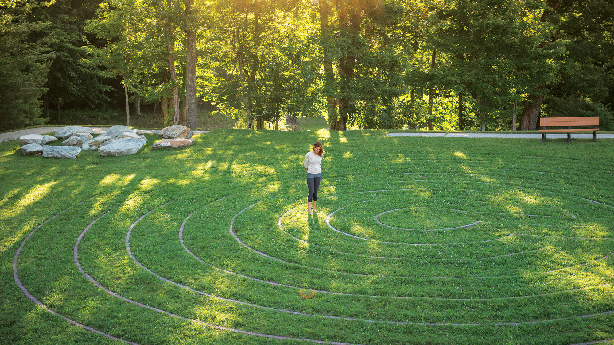 A guest at the Art of Living Retreat Center engages in a meditative labyrinth walk.