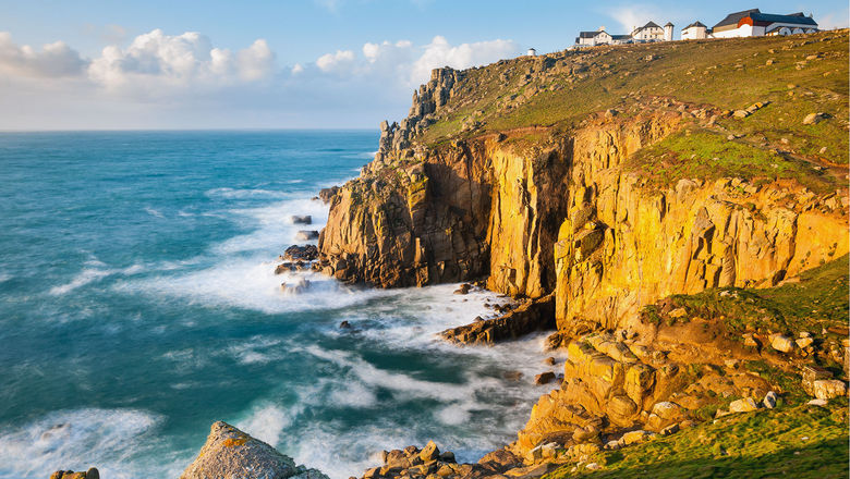 A falling pound means Americans will pay less for a U.K. vacation. Pictured, Land's End, a big tourism draw in England.