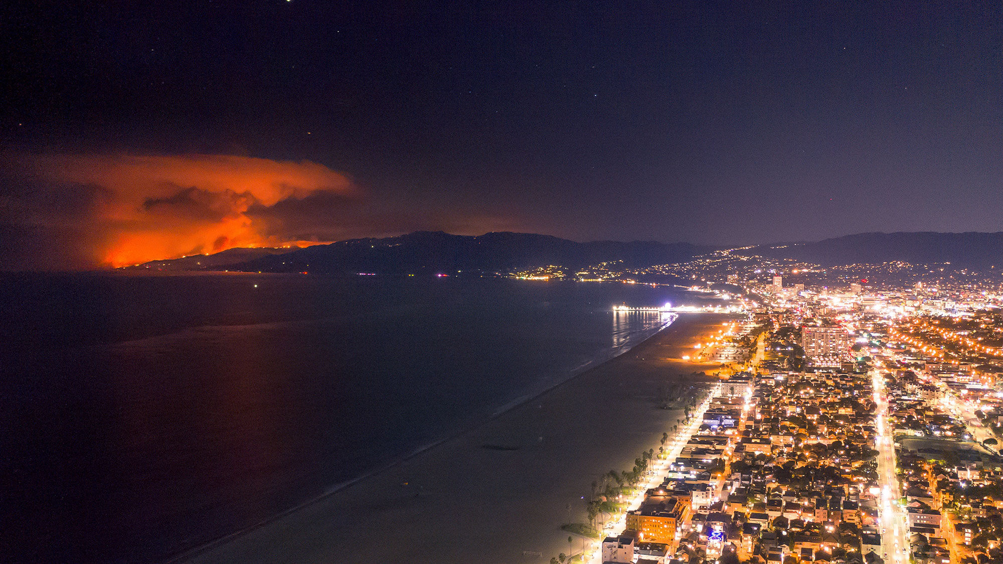 Earlier this month, the Woolsey fire lit up the night along the Venice Beach coastline.