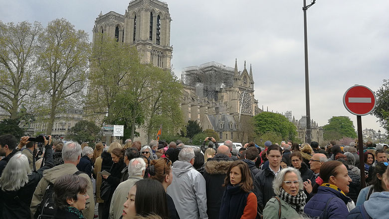 The fire-damaged Notre Dame Cathedral attracting a crowd on April 16.