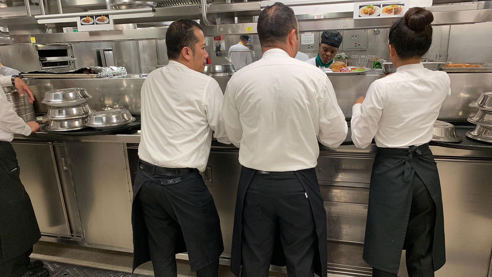Wait staff in a cruise ship galley.