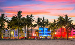 The beach along Ocean Drive in Miami Beach at dusk.