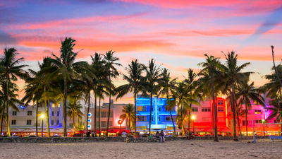 The beach along Ocean Drive in Miami Beach at dusk.