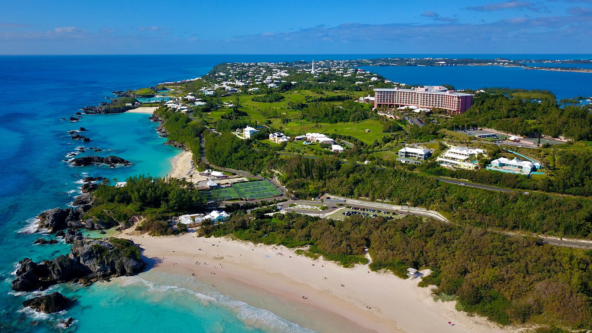 An aerial shot of Bermuda, with the Fairmont Southampton resort and pink-sand beaches visible. The island is enacting a stay-at-home order due to rising Covid cases.
