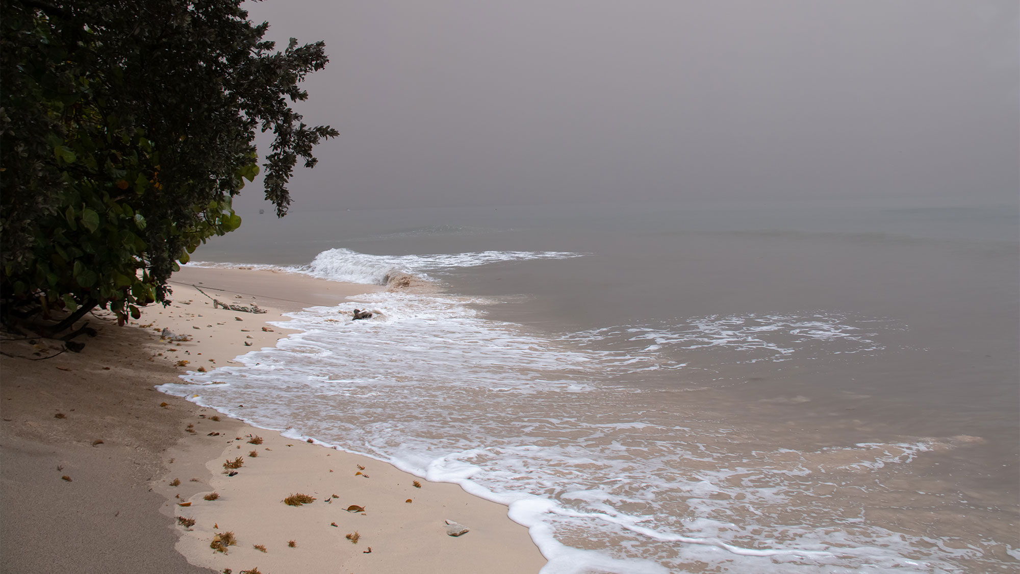 The air off a beach in St. James, Barbados, was thick over the weekend with ash from La Soufriere volcano in St. Vincent, which has been erupting since April 9.