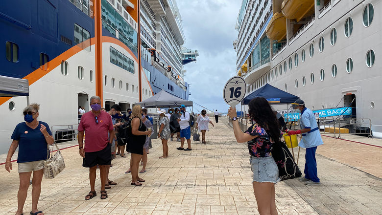 Passengers on a curated bubble tour disembarking the Celebrity Edge in Cozumel. The Adventure of the Seas is across the pier.