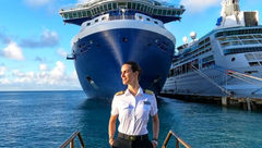 Captain Kate McCue in front of the Celebrity Edge.
