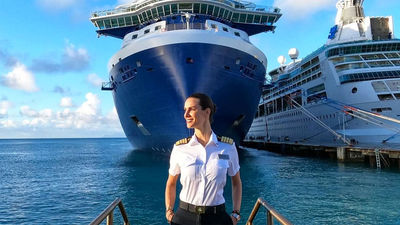 Captain Kate McCue in front of the Celebrity Edge.