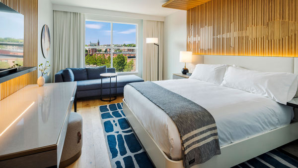 A City View Guestroom, with Canopy by Hilton's signature Canopy Bed. All bed linens at the hotel are by Cuddledown, and the throw is by Evangeline. A City View Guestroom, with Canopy by Hilton's signature Canopy Bed. All bed linens at the hotel are by Cuddledown, and the throw is by Evangeline.