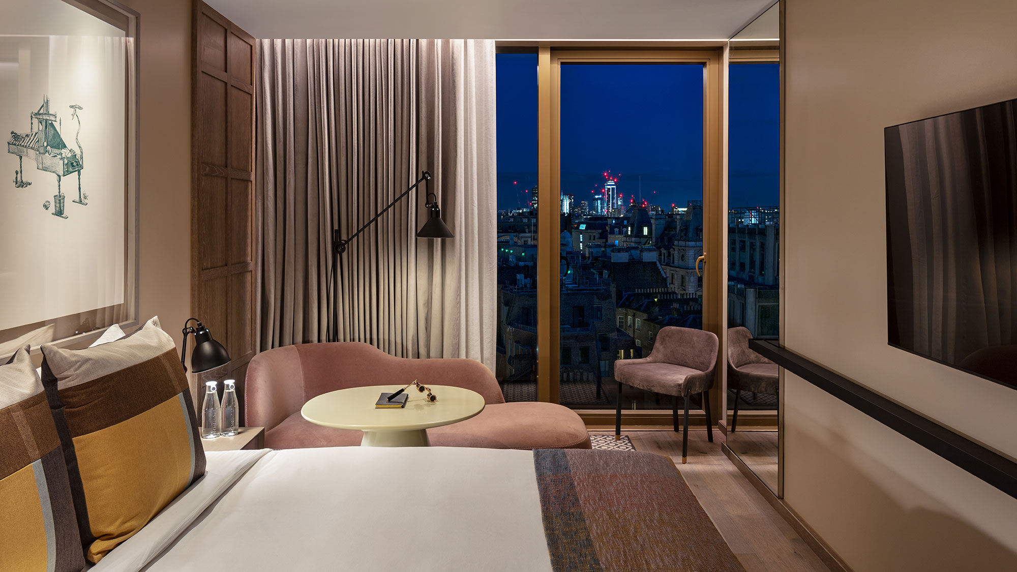 A Deluxe King guestroom at the Londoner on Leicester Square.