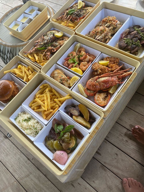 A splendid spread of lobster, shrimp and steak served at a Beach Cabana in the Coco Beach Club section of Perfect Day at CocoCay.