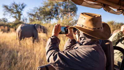 An Abercrombie & Kent guest on safari. A&K said travel advisors have been in touch with A&K, asking about omicron and its potential impact on clients' plans.