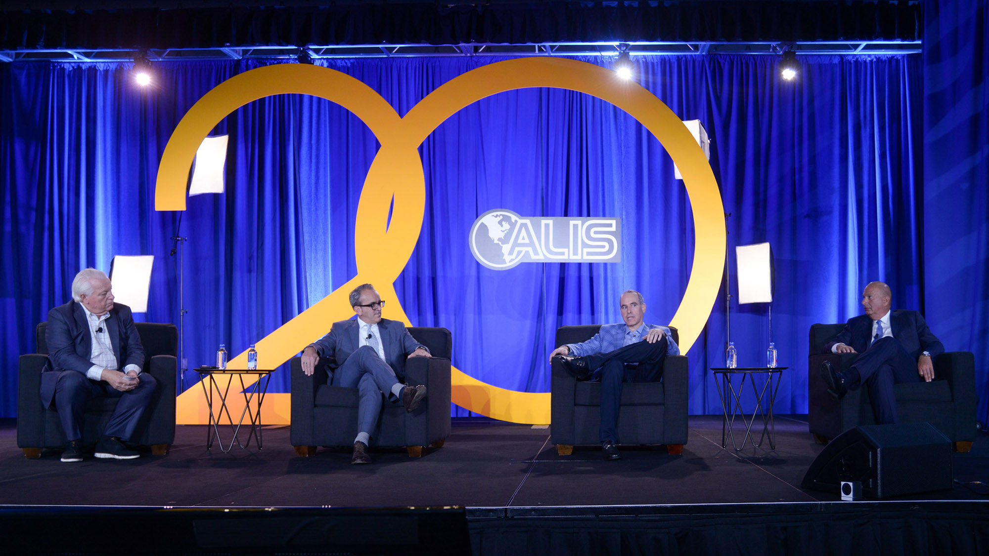 Moderator Roger Dow, president and CEO of U.S. Travel Association, leads a panel discussion at ALIS 2021 with, from left, Sonesta CEO Carlos Flores, Peachtree Hotel Group CEO Greg Friedman and founder and chairman of Provenance Hotels Gordan Sondland.