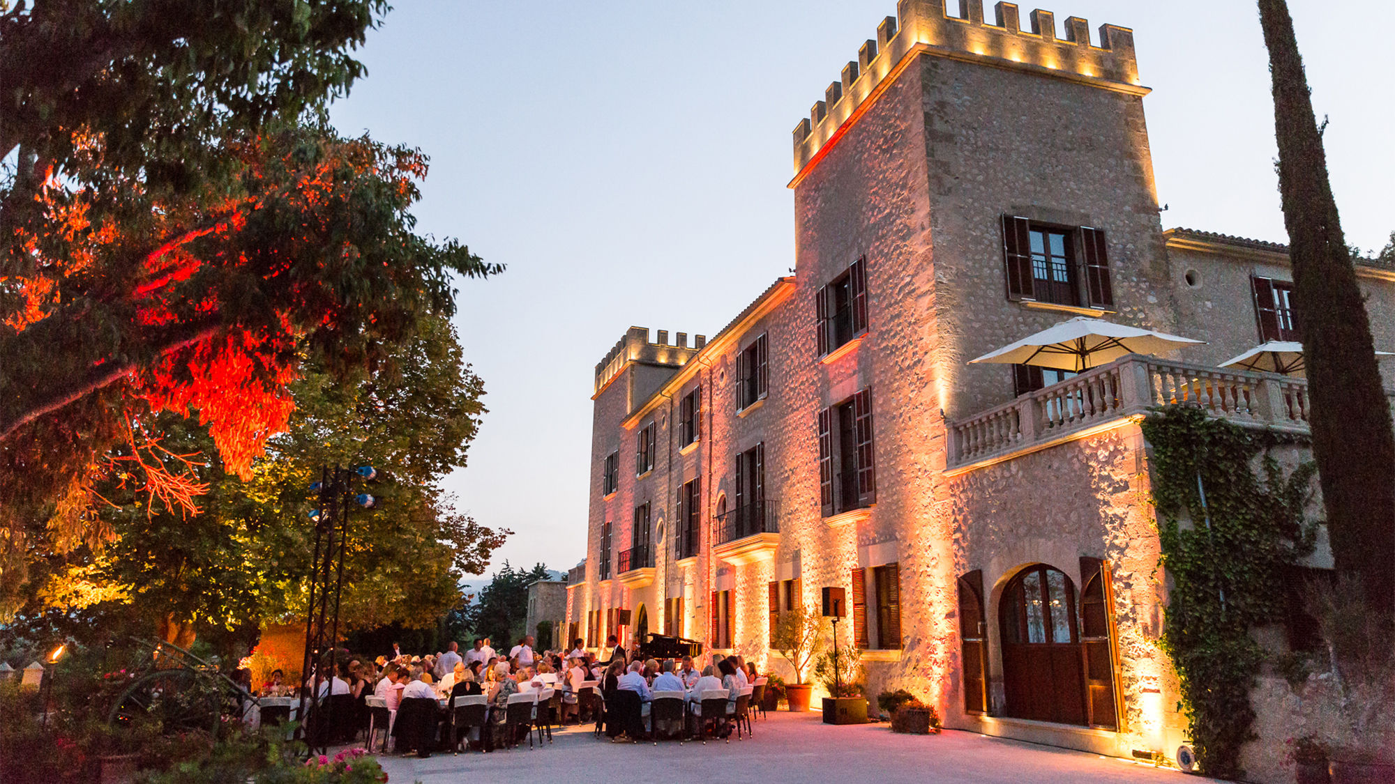 Diners at Sa Clastra, the new alfresco gourmet restaurant at Castell Son Claret on Mallorca, Spain.