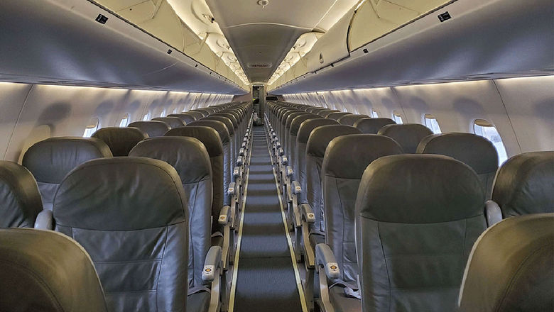 The interior of a JetBlue E190 aircraft.