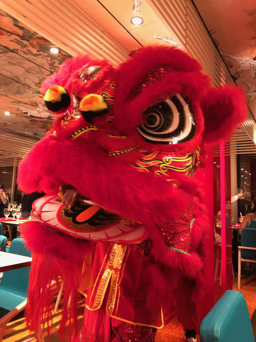 A Chinese dragon entertains during dinner at Chibang!, a new restaurant on Carnival Mardi Gras that serves Mexican and Chinese food. A Chinese dragon entertains during dinner at Chibang!, a new restaurant on Carnival Mardi Gras that serves Mexican and Chinese food.