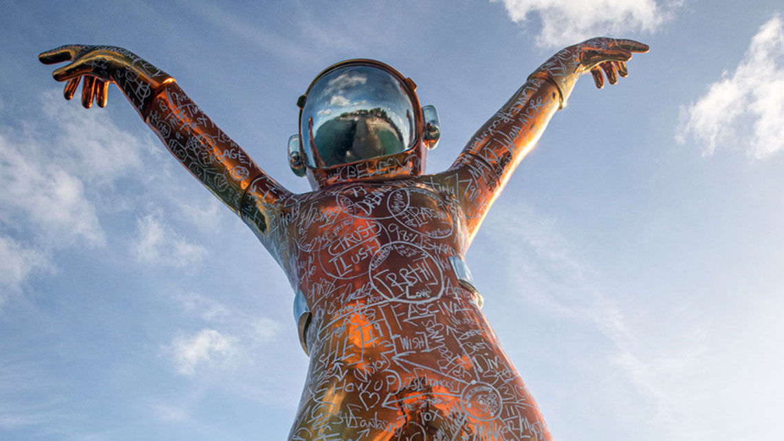 The Boonji Spaceman sculpture dominates the pier at Hodges Bay Resort & Spa in Antigua.