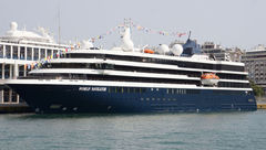 Atlas Ocean Voyages' World Navigator docked in Piraeus, Greece.