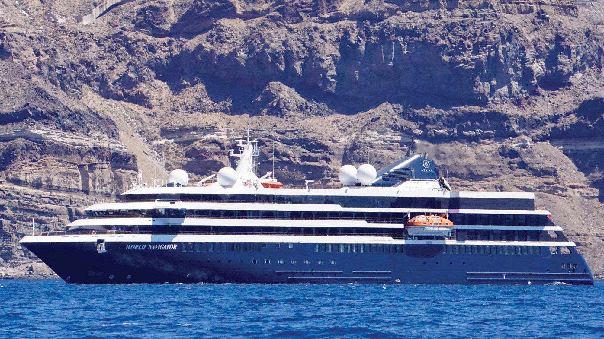 Atlas Ocean Voyages' World Navigator in Santorini earlier this summer. Atlas requires that all passengers be vaccinated.