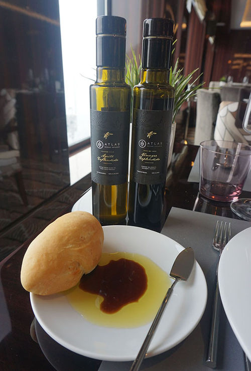 Lunch tables are set with Atlas-branded olive oil and balsamic vinegar.