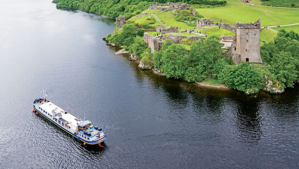 European Waterways' Scottish Highlander cruising on Scottland's Loch Ness past Urquhart Castle.