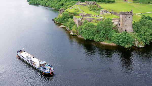 European Waterways European Waterways' Scottish Highlander cruising on Scottland's Loch Ness past Urquhart Castle.