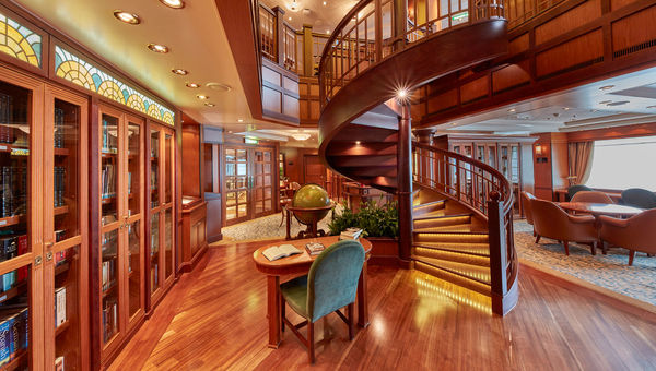 The library on the Queen Elizabeth spans two decks and contains more than 7,000 volumes. The library on the Queen Elizabeth spans two decks and contains more than 7,000 volumes.
