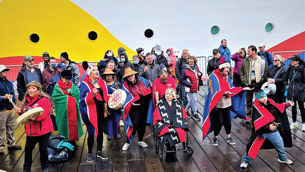 Members of the Huna community of the Tlingit tribe perform a dance to welcome the Encore to Icy Strait Point. Members of the Huna community of the Tlingit tribe perform a dance to welcome the Encore to Icy Strait Point.
