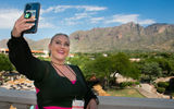 Shayla Northcutt of Northcutt Travel Agency snaps a selfie in front of the Catalina Foothills, the backdrop of the Westin la Paloma in Tucson, Ariz., GTM West's host property.