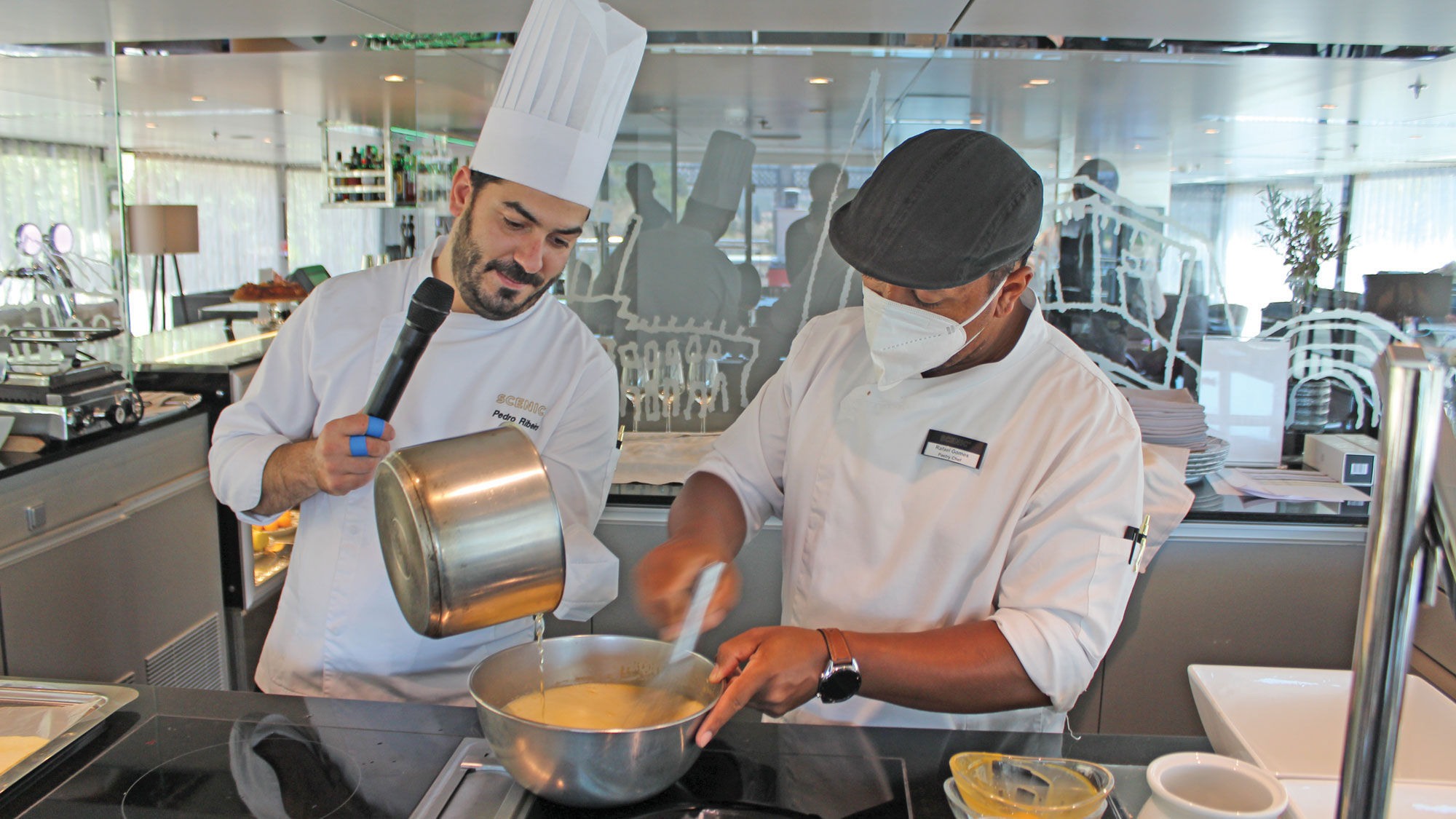 Executive chef Pedro Ribeiro and pastry chef Rafael Gomes during a pastry cooking demonstration on the Scenic Azure.