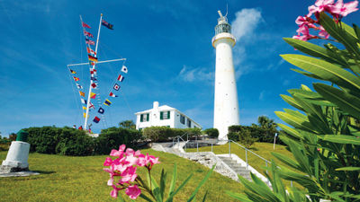 The cast-iron Gibbs Hill Lighthouse, built in 1846, overlooks the south shore of Bermuda with views of Hamilton in the distance.