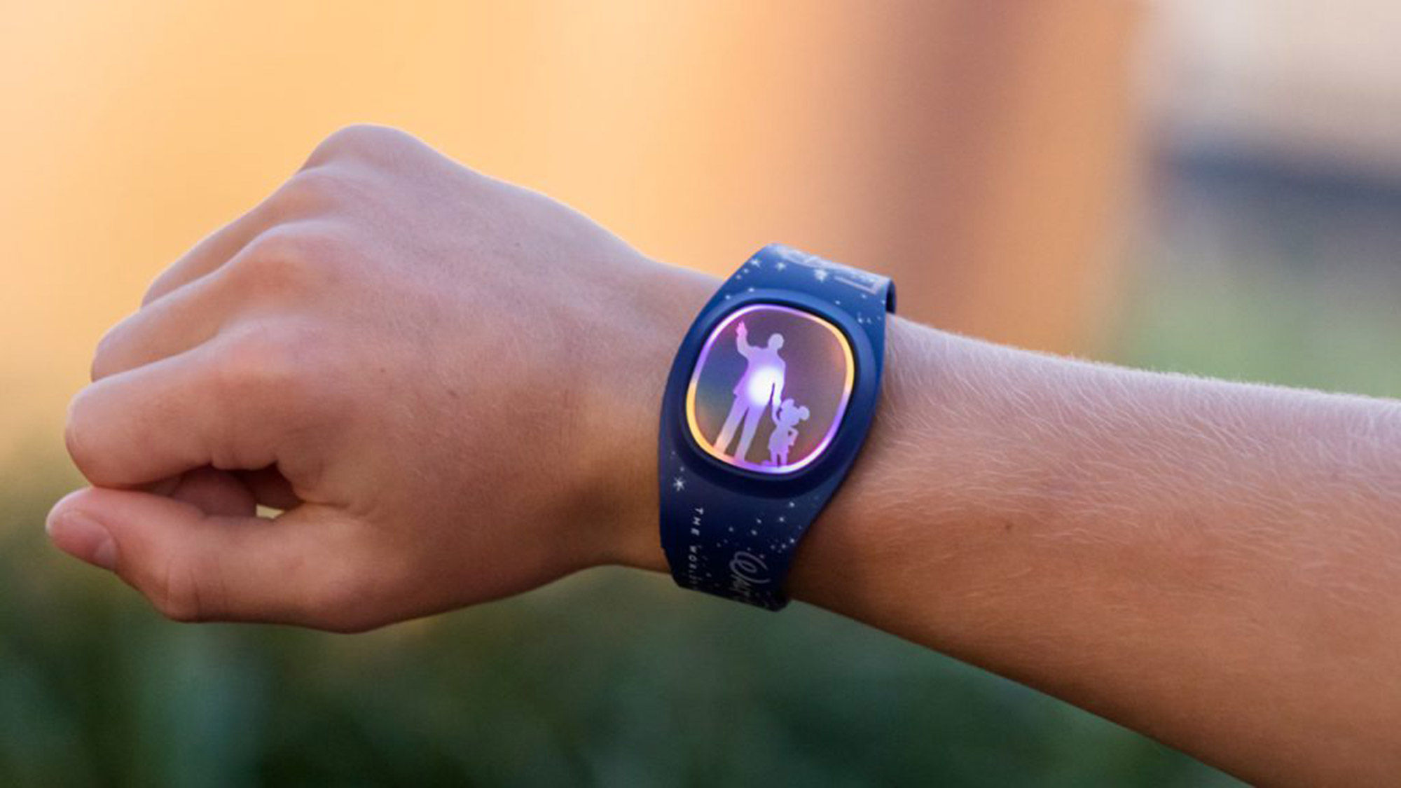 Disney's MagicBand+ will light up in sync with theme park show like "Harmonious."