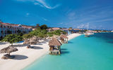 The beach today at Sandals Montego Bay features palapas on the sand to shade guests relaxing on chaise lounges and cabanas set right at the shoreline.