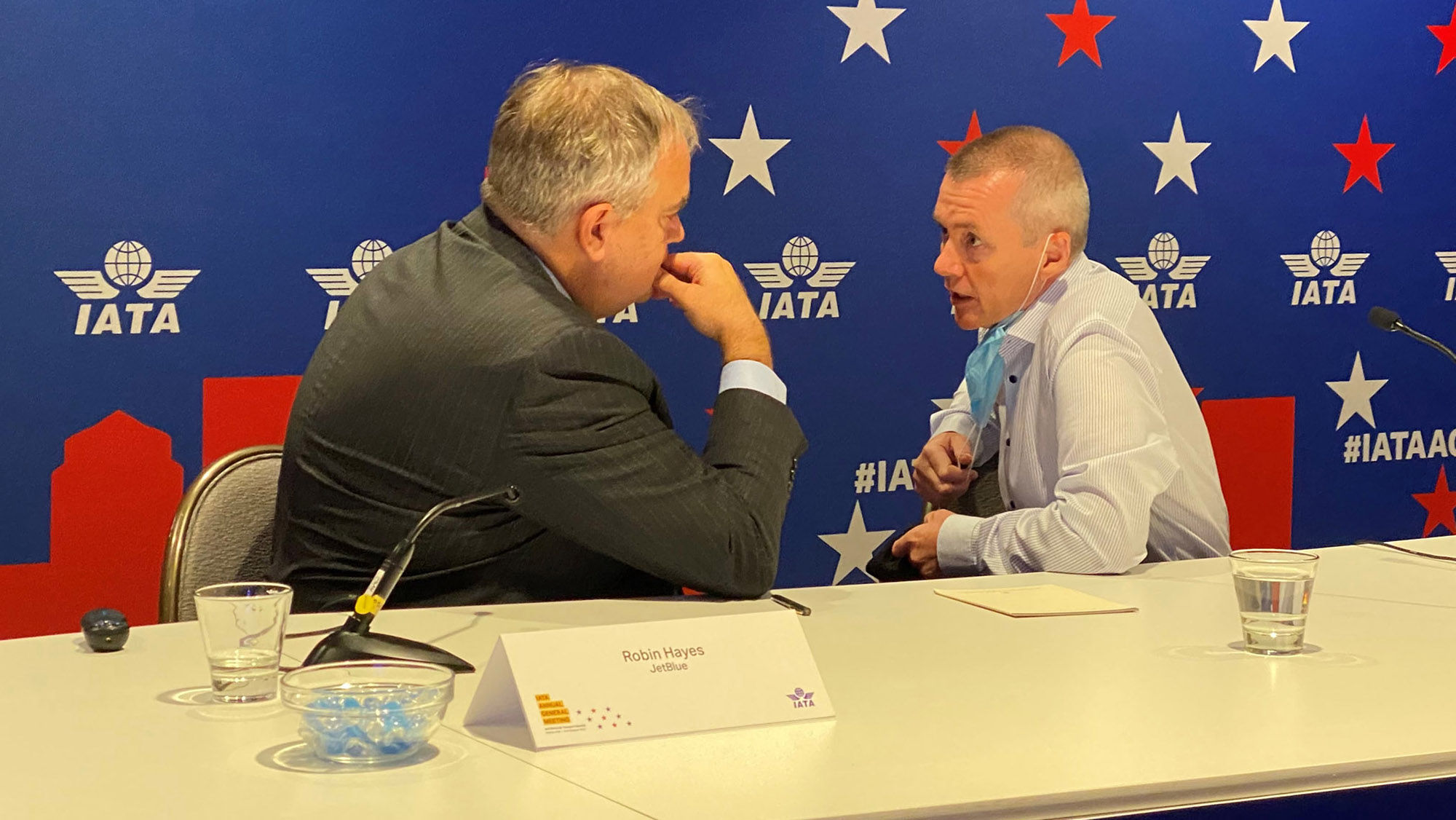 IATA chairman and JetBlue CEO Robin Hayes, left, conferring with IATA director general Willie Walsh in Boston.