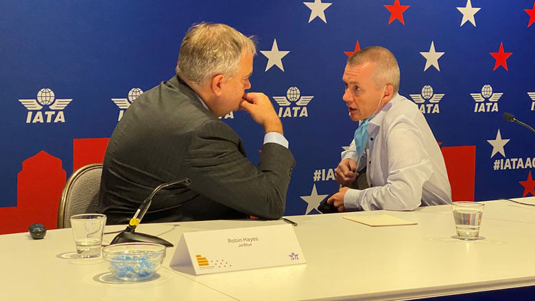 IATA chairman and JetBlue CEO Robin Hayes, left, conferring with IATA director general Willie Walsh in Boston.