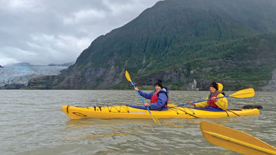 The writer, right, on a kayaking adventure on Mendenhall Lake.