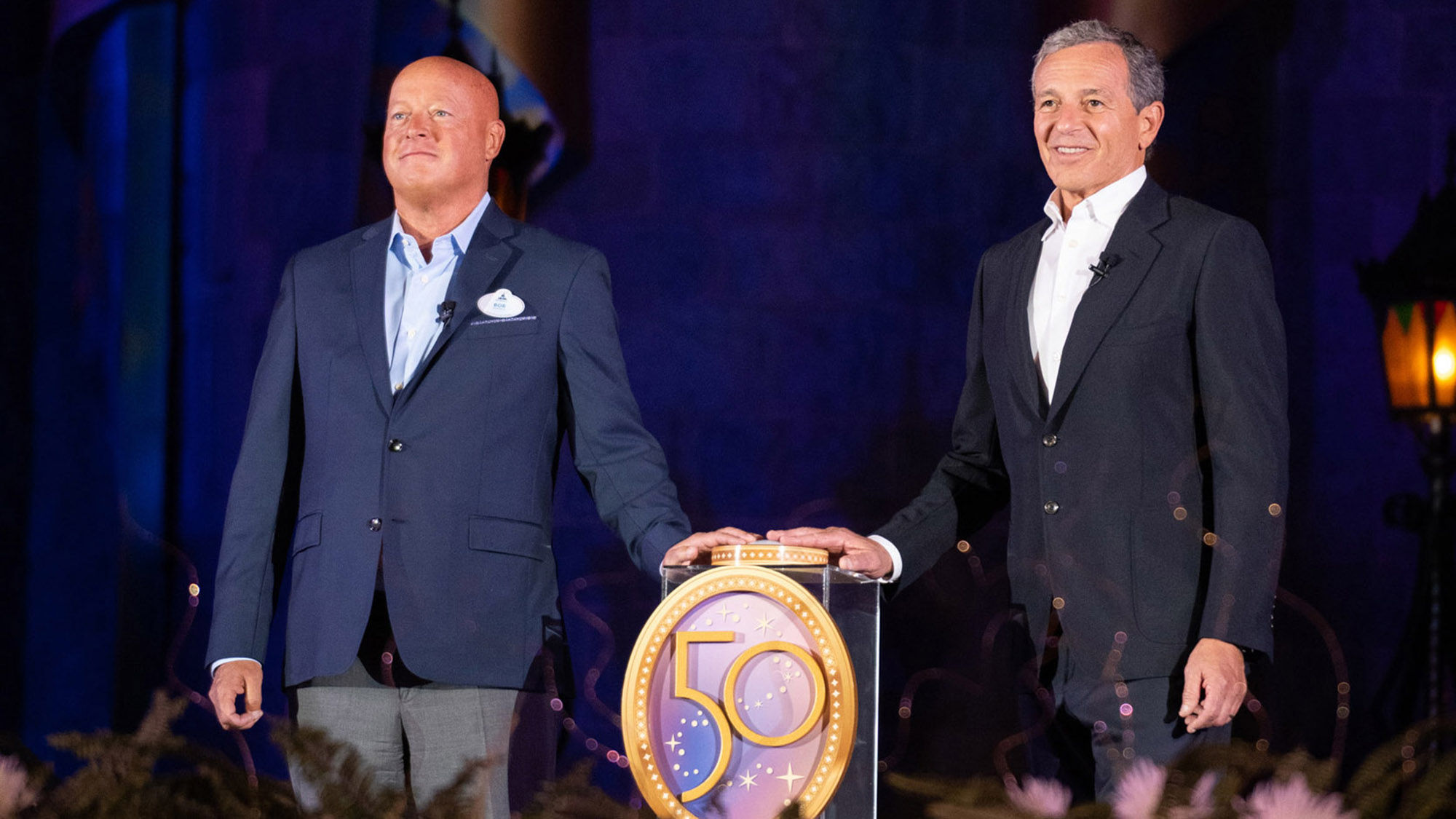 Disney CEO Bob Chapek, left, and executive chairman Bob Iger rededicate the Walt Disney World Resort in front of Cinderella Castle at the Magic Kingdom Park on the eve of the park's 50th anniversary.