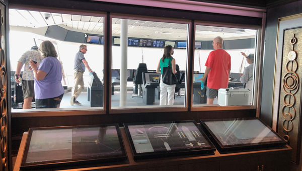 The Captain's Lounge lets guests observe actions on the bridge when it is closed. The Captain's Lounge lets guests observe actions on the bridge when it is closed.