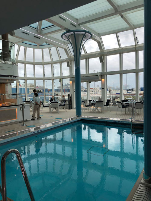 The Solarium is a two-deck, glass-enclosed aft area that includes the swimming pool and the Marketplace casual cafe.