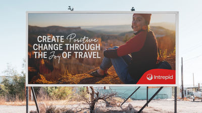 A billboard mockup showing Intrepid Travel's new brand positioning.