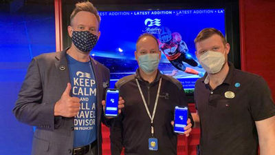 From left: John Chernesky, Princess' senior vice president, North America sales & trade marketing; guest Mark Wilson, who placed the first bet on Ocean Sportsbook; and Kevin Tugwell, Majestic Princess cruise director.
