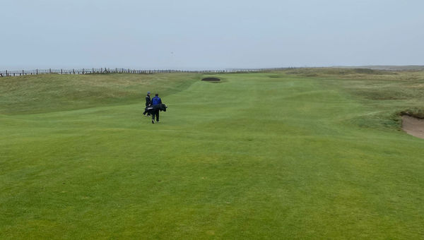 Walking toward the green on the second hole at Royal Porthcawl. Walking toward the green on the second hole at Royal Porthcawl.