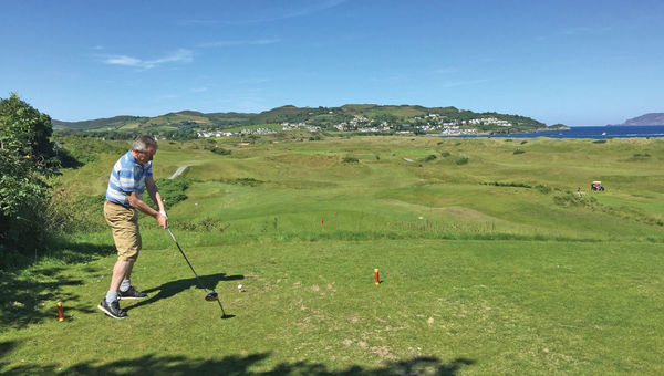 A golfer tees off at Portsalon Golf Club In County Donegal, Ireland.