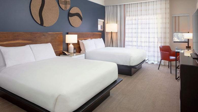Amara redid rooms in neutral tones with a deep-blue accent wall.
