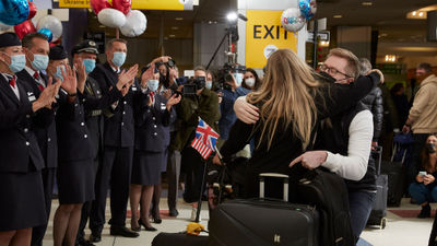 Loved ones reunite after British Airways BA001 flight arrives in New York.
