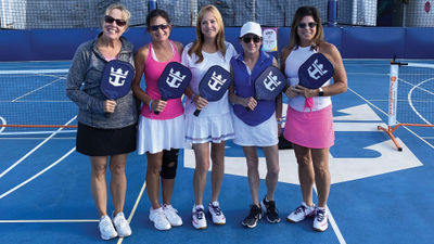 Vicki Freed, Royal Caribbean International’s senior vice president of sales, trade support and service, center, on the Freedom of the Seas with a group of her pickleball playing friends in October.
